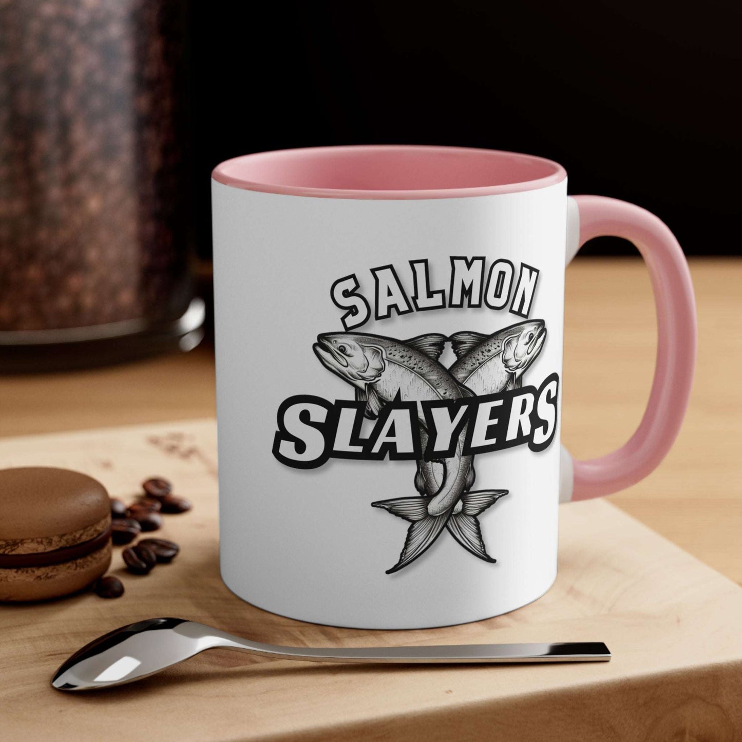 Salmon Slayers - Accent Coffee Mug, 11oz with a colored interior and handle, featuring a black and white illustration of two crossed salmons and the text "salmon slayers" on its side.