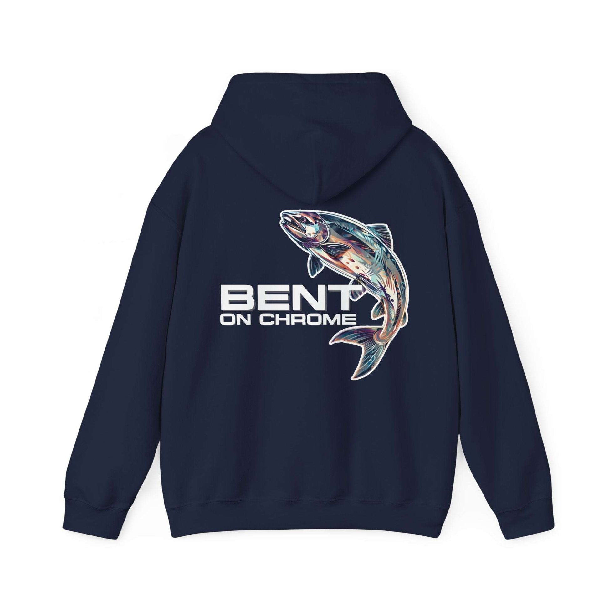 The Bent On Chrome Pull Over Hoodie - Silver Salmon, made from a cotton/poly blend, features an illustration of a fish, possibly a trout, leaping out of the water on the back. Below the fish, the text reads "BENT ON CHROME," making it perfect for any fishing enthusiast. The dark-colored unisex heavy blend hoodie is laid flat and facing backward.