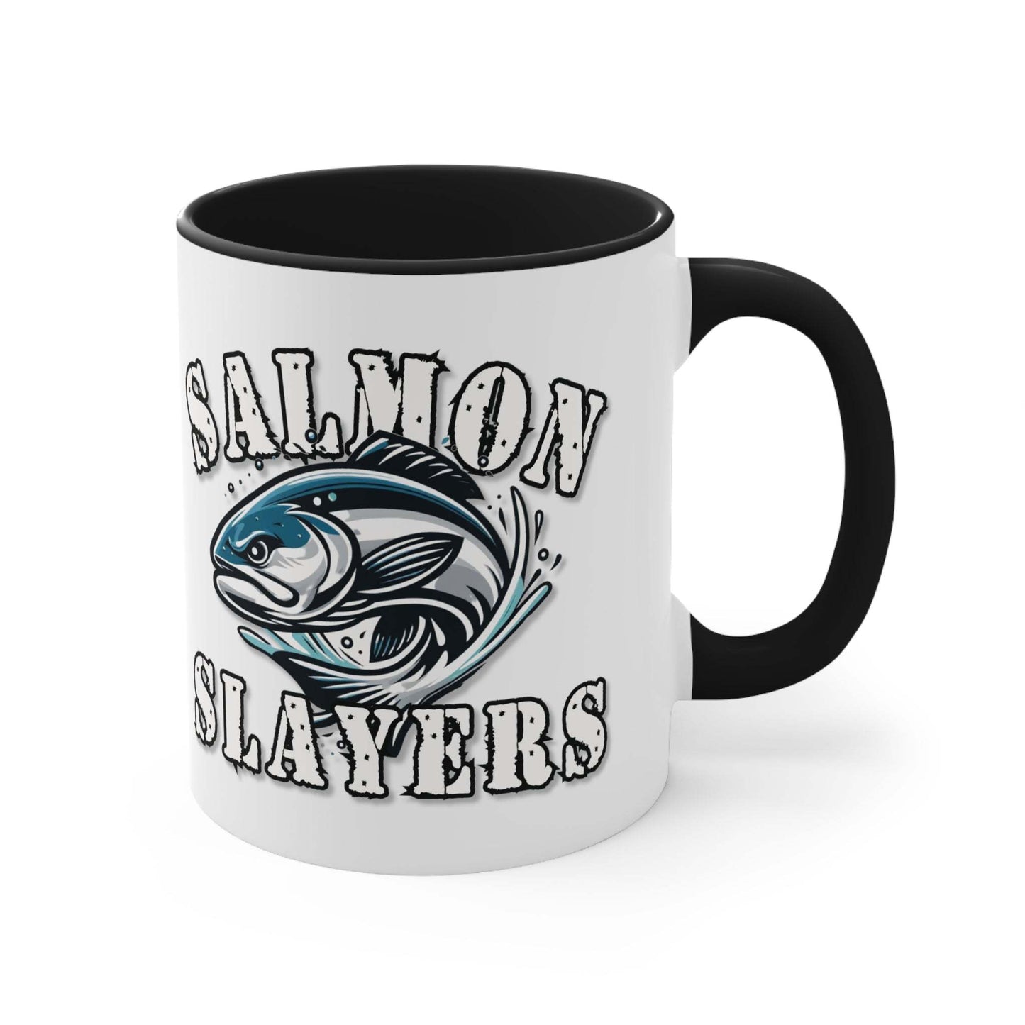 A white custom Salmon Slayers - Fierce Flash - Accent Coffee Mug, 11oz with a blue interior and C-handle features the design "Salmon Slayers" with a stylized illustration of a salmon in the center. The mug, showcasing an eye-catching color contrast, is placed on a wooden surface next to a small macaron, coffee beans, and a spoon.