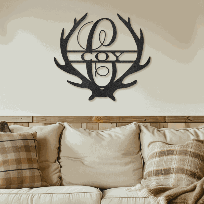 Antler Monogram customizable laser-cut steel sign with rustic antler design above a sofa.