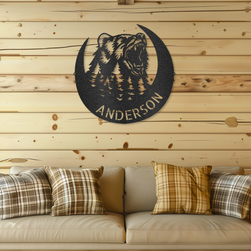 Roaring Bear Monogram laser-cut steel sign on wooden wall with plaid couch.