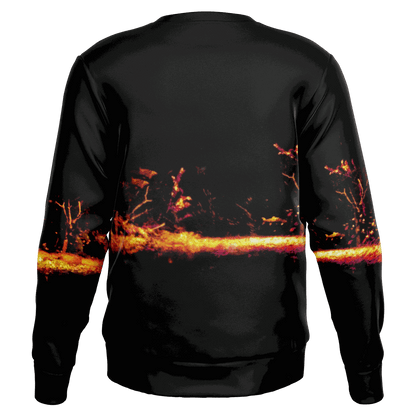 Introducing the Sonar Live Sweatshirt: a black pullover adorned with an abstract design showcasing fiery orange and pink hues in a horizontal band across the back, reminiscent of vibrant landscapes or flames. Ideal for adding flair to your fishing wardrobe with its distinctive style.