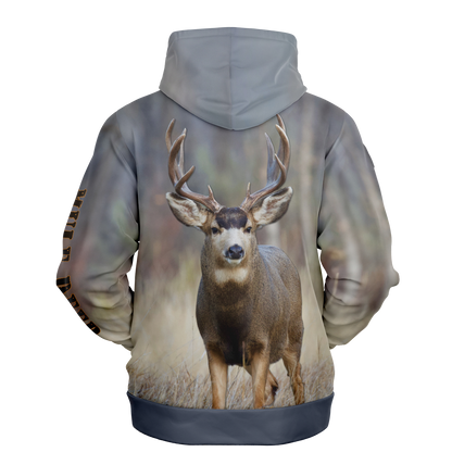 A hoodie with a nature-inspired design, featuring a gradient of earthy tones from top to bottom, transitioning from dark brown and blue to light beige and cream. The center displays an "UPB4DAWN" logo with stylized antlers. The right sleeve has "COMPANY" printed vertically, perfect for any Majestic Mule Deer - Tri-Blend Hoodie enthusiast.