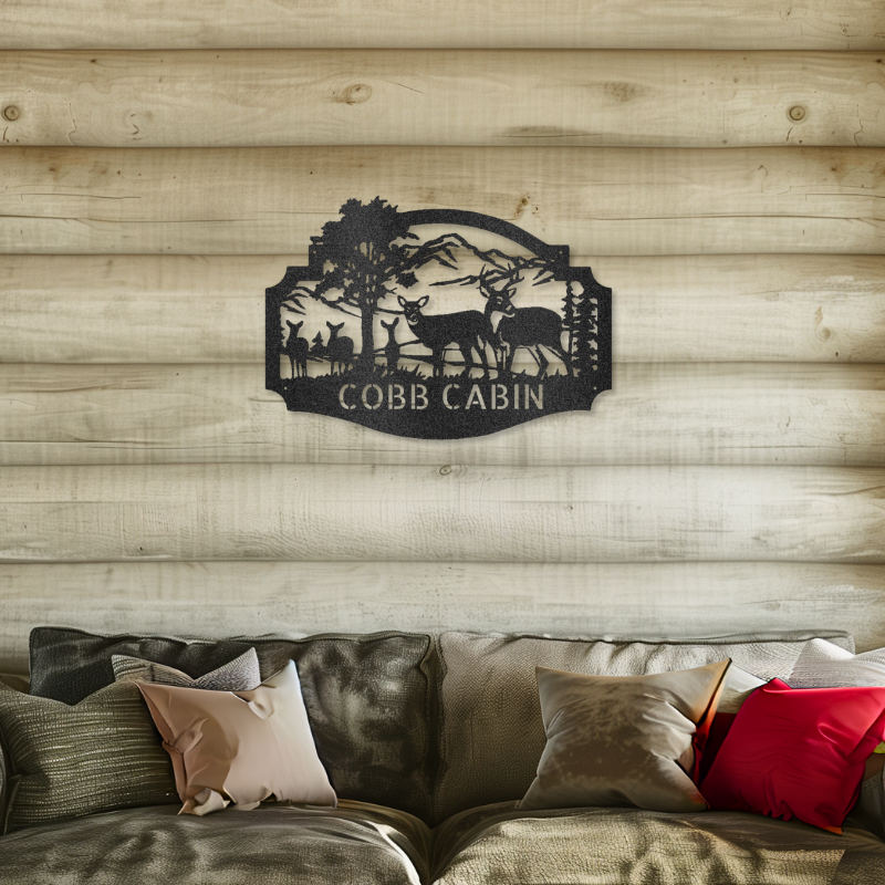 Deer family monogram laser-cut steel sign on log cabin wall displaying "COBB CABIN," with customizable text space.