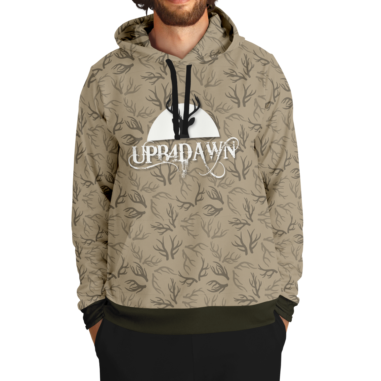 The Deer Hunter - Antler Whisper - Tri-Blend Hoodie - Khaki boasts a beige hue with a black tree branch pattern and a handy front pocket. Featuring the UPB4DAWN logo in white and an image of bare branches against a circular background, this hoodie is perfect for any outdoor adventure. The cuffs and hem are stylishly black.