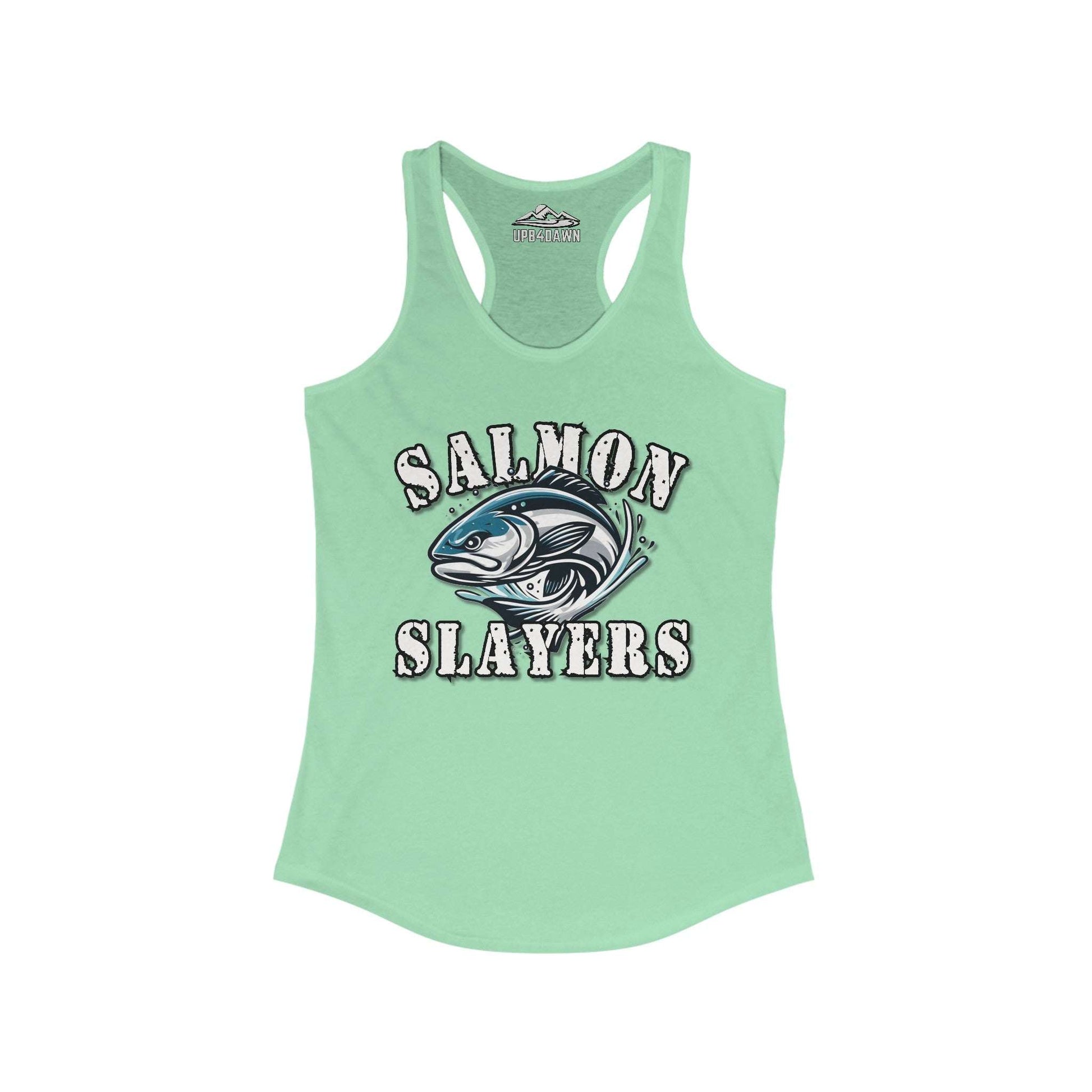 A purple "Salmon Slayers - Fierce Flash - Women's Racerback Tank Top" with the words "Salmon Slayers" printed in white on the front, accompanied by an illustration of a salmon fish. The extra light fabric and racerback cut ensure comfort, while the brand name "Up & Dawn" is visible at the inside back.