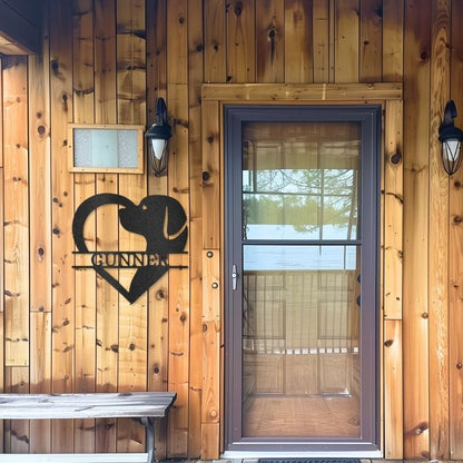 Customizable laser-cut steel sign featuring a heart-shaped dog monogram on a wooden wall.