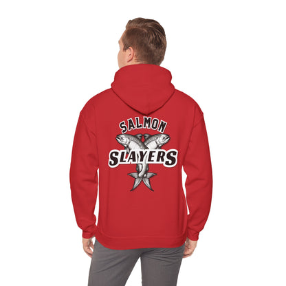 A man stands with his back to the viewer, highlighting the Salmon Slayers – Twin Salmon Logo Hoodie. This unisex red hooded sweatshirt features a graphic of two fish and "Salmon Slayers" text, designed from a comfortable cotton/poly blend.