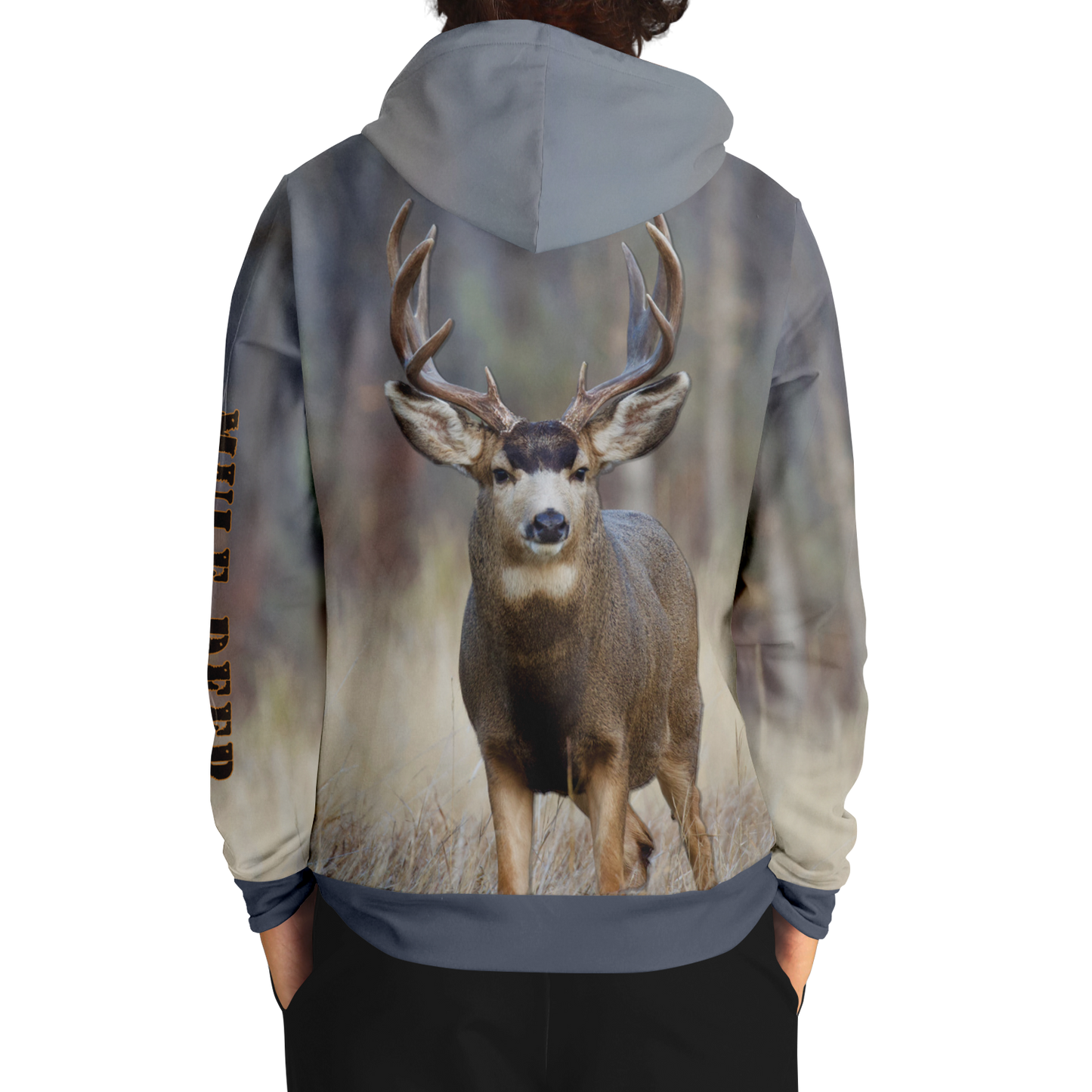 A hoodie with a nature-inspired design, featuring a gradient of earthy tones from top to bottom, transitioning from dark brown and blue to light beige and cream. The center displays an "UPB4DAWN" logo with stylized antlers. The right sleeve has "COMPANY" printed vertically, perfect for any Majestic Mule Deer - Tri-Blend Hoodie enthusiast.