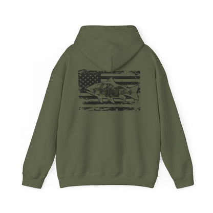 The Reeling In Freedom - Cotton/Poly Blend - Hoodie, ideal for any fishing enthusiast, is depicted from the front and back. The front showcases a small fish graphic accompanied by "Feeling of Freedom" text on the left chest, while the back prominently features a large fish graphic set against a distressed American flag design, celebrating American pride.