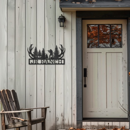 Hunting Monogram customizable laser-cut steel sign with antlers by door.