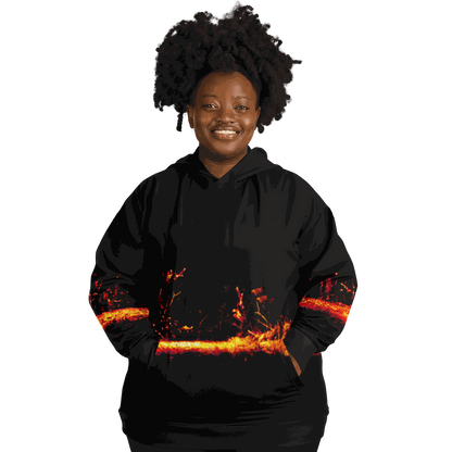 A person is smiling while wearing the Sonar Live Plus-size Hoodie, which showcases a fiery design across the middle. The tri-blend fabric offers both comfort and style in a plus-size fit, with a plain black background that highlights the hoodie’s vibrant colors.