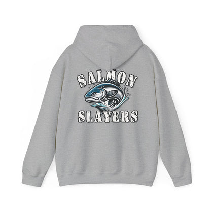 A Salmon Slayers - Fierce Flash - Cotton/Poly Blend Hoodie featuring a graphic of a salmon in mid-swim, with water splashes around it, and the text "Salmon Slayers" printed above and below the fish in bold, white letters with a distressed texture. Crafted from ethically grown US cotton for ultimate comfort.