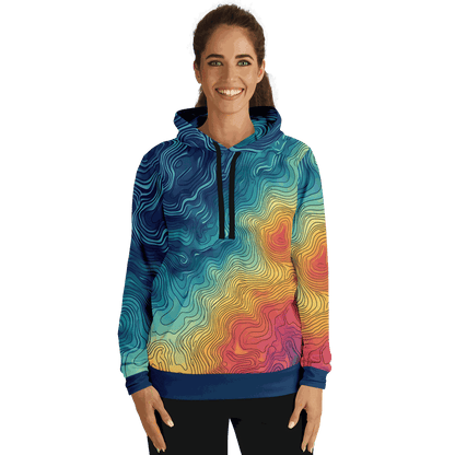 The Depth Explorer Pull Over Hoodie - Tri-Blend features a vibrant array of intricate, wavy line patterns in shades of blue, green, yellow, and red. These designs mimic underwater contours on a topographic map, giving the garment a textured and flowing look throughout. The ensemble includes the hood up and hands tucked into the front pocket.