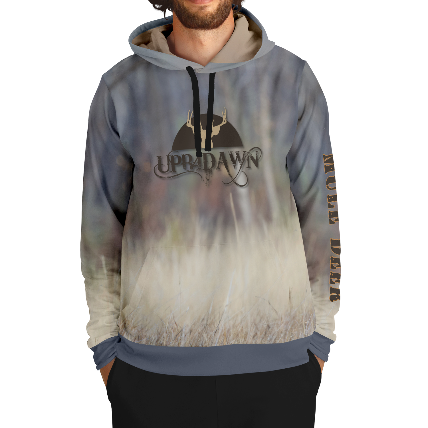 A hoodie with a nature-inspired design, featuring a gradient of earthy tones from top to bottom, transitioning from dark brown and blue to light beige and cream. The center displays an "UPB4DAWN" logo with stylized antlers. The right sleeve has "COMPANY" printed vertically, perfect for any Majestic Mule Deer - Tri-Blend Hoodie enthusiast.