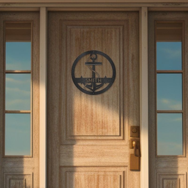 Customizable laser-cut steel sign with an elaborate anchor design on a wooden door.