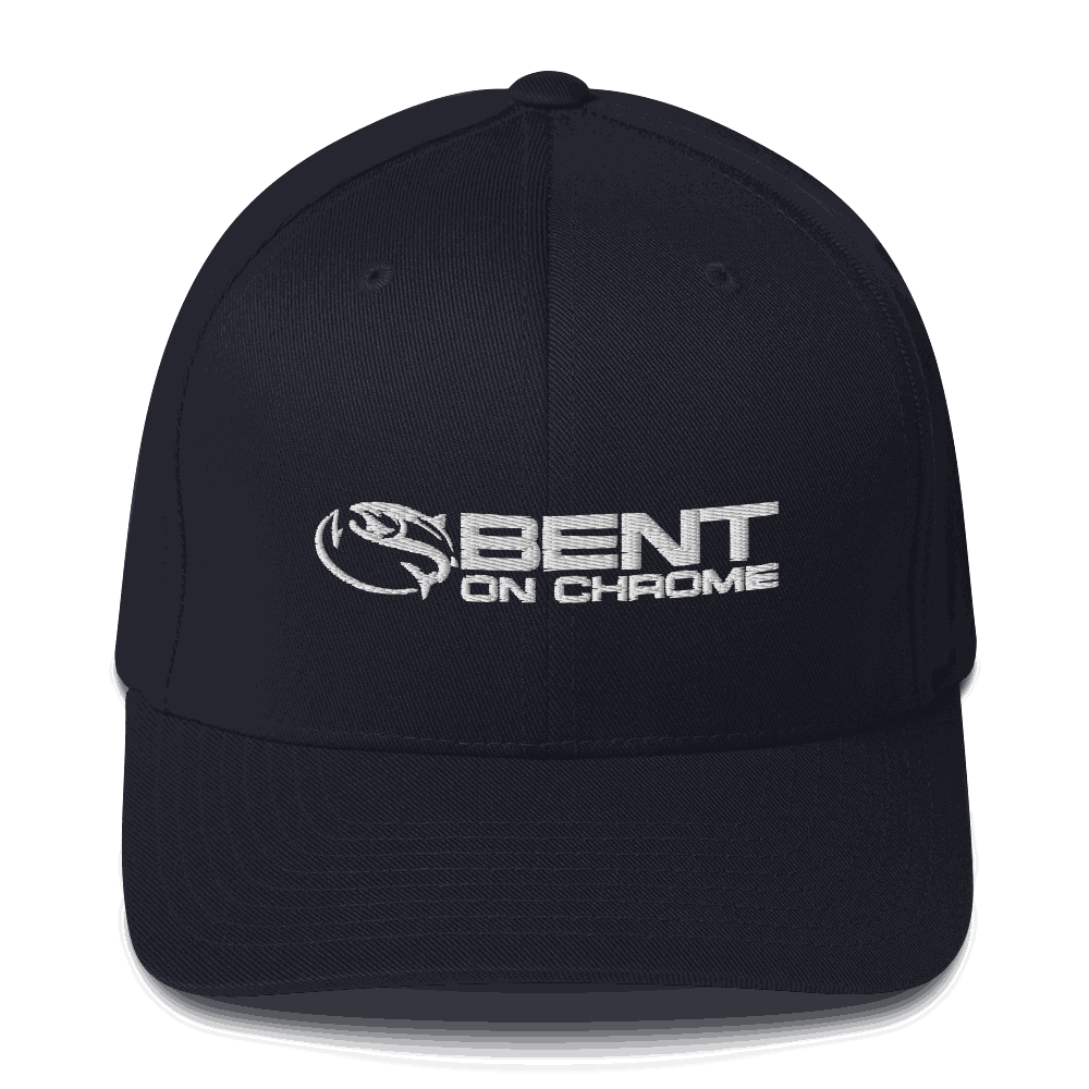 A camouflage athletic hat featuring the Bent on Chrome logo embroidered in white on the front. The cap has a structured design with a curved brim.