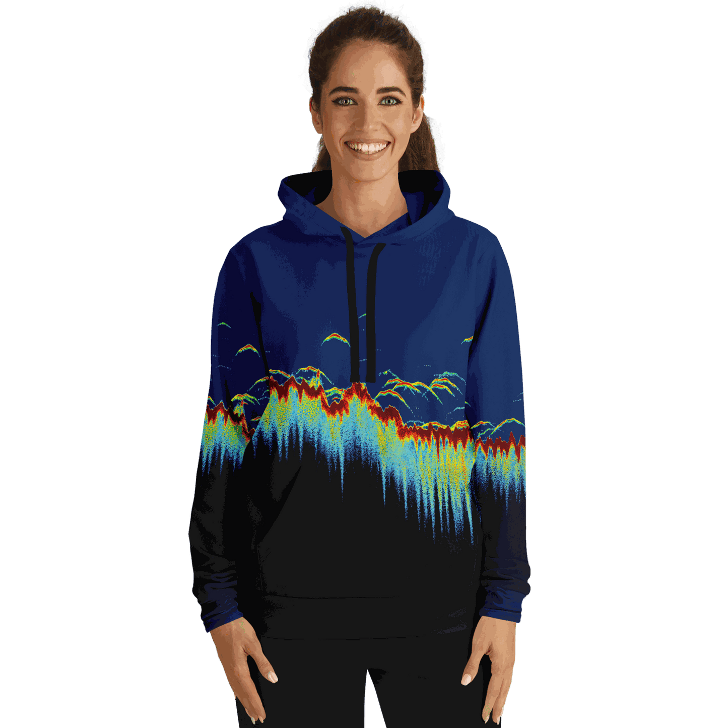 A woman smiles warmly while wearing the Sonar Scan Hoodie, adorned with a lively, abstract design resembling a digital soundwave set against a dark backdrop. This tri-blend hoodie is ideal for introducing distinctive style to any fishing wardrobe.