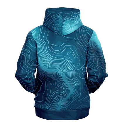 The Deep Blue Depth Map Hoodie showcases a topographic design in shades of blue and teal. It features swirling underwater contours, creating an abstract map-like appearance, complete with a hood and long sleeves. The hoodie is displayed from the back against a black background.