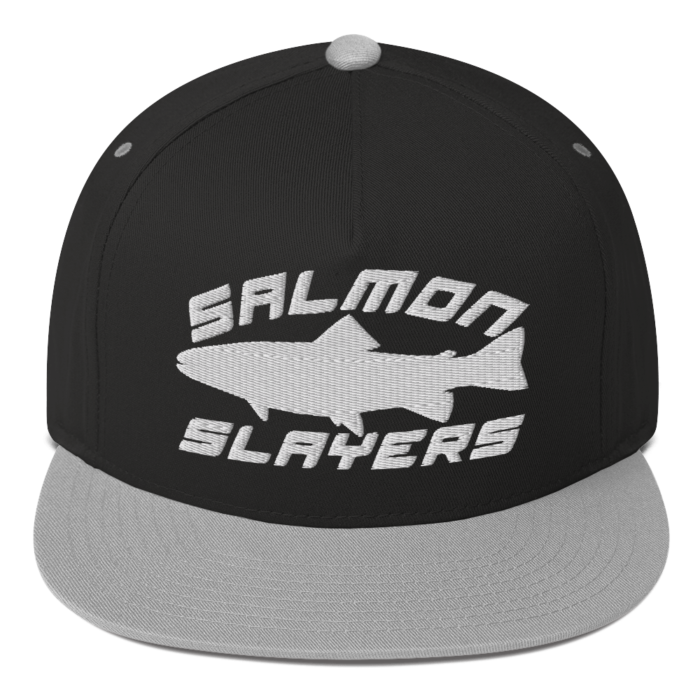 A black ***Salmon Slayers - Sport - Flat Bill Cap*** with a high-profile fit and snapback closure, featuring an embroidered design of a stylized salmon and "SALMON SLAYERS" in bold white letters above and below the fish. The green undervisor adds a unique touch to this stylish cap.