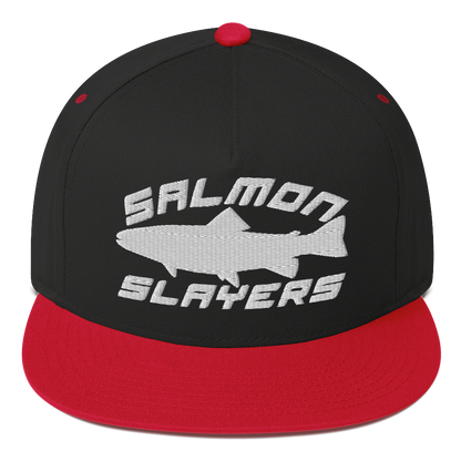 A black ***Salmon Slayers - Sport - Flat Bill Cap*** with a high-profile fit and snapback closure, featuring an embroidered design of a stylized salmon and "SALMON SLAYERS" in bold white letters above and below the fish. The green undervisor adds a unique touch to this stylish cap.