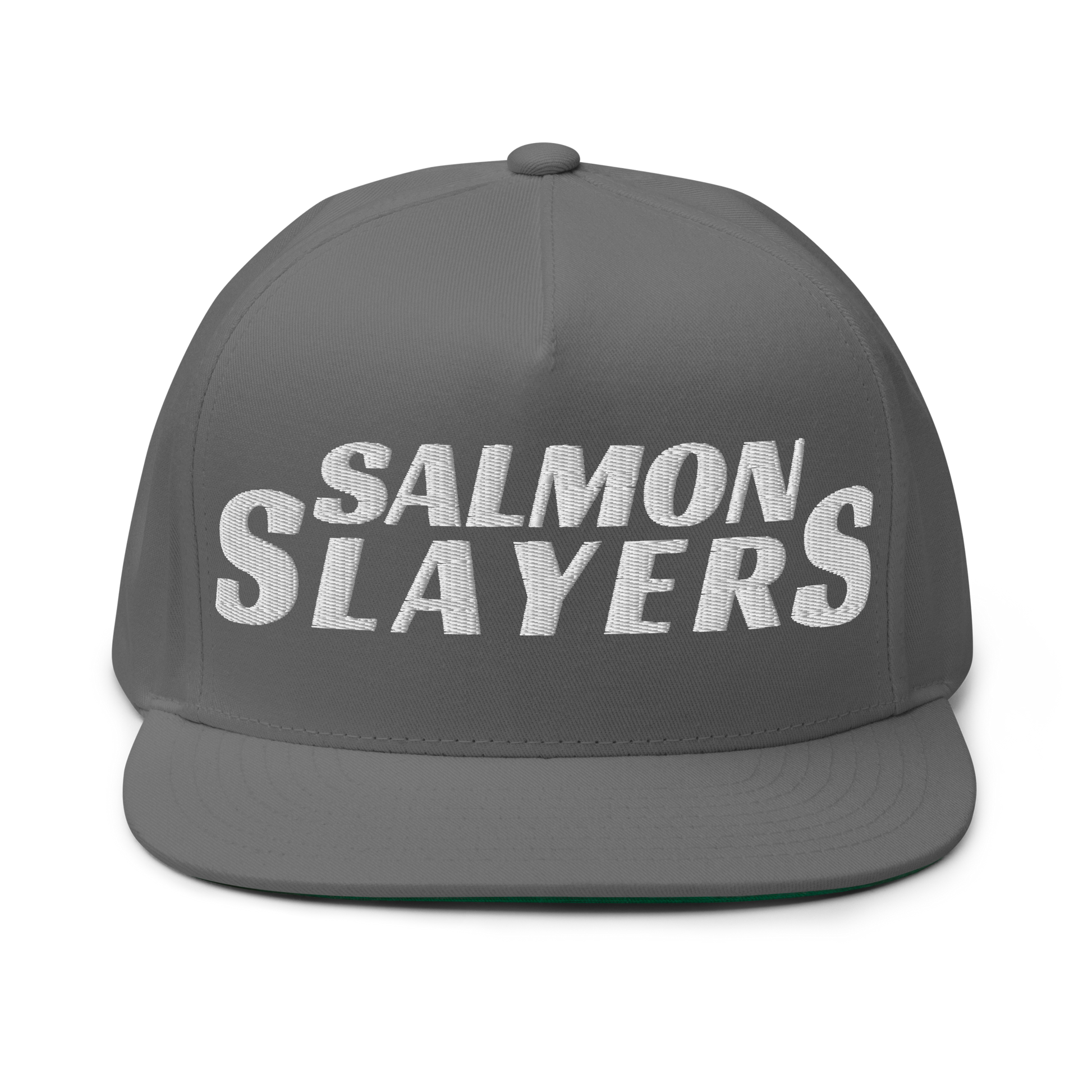 The Salmon Slayers - Flat Bill Cap is a stylish gray baseball hat made from cotton twill, set against a black background and boldly embroidered with "SALMON SLAYERS" in white. It features a snapback closure to ensure the perfect fit.