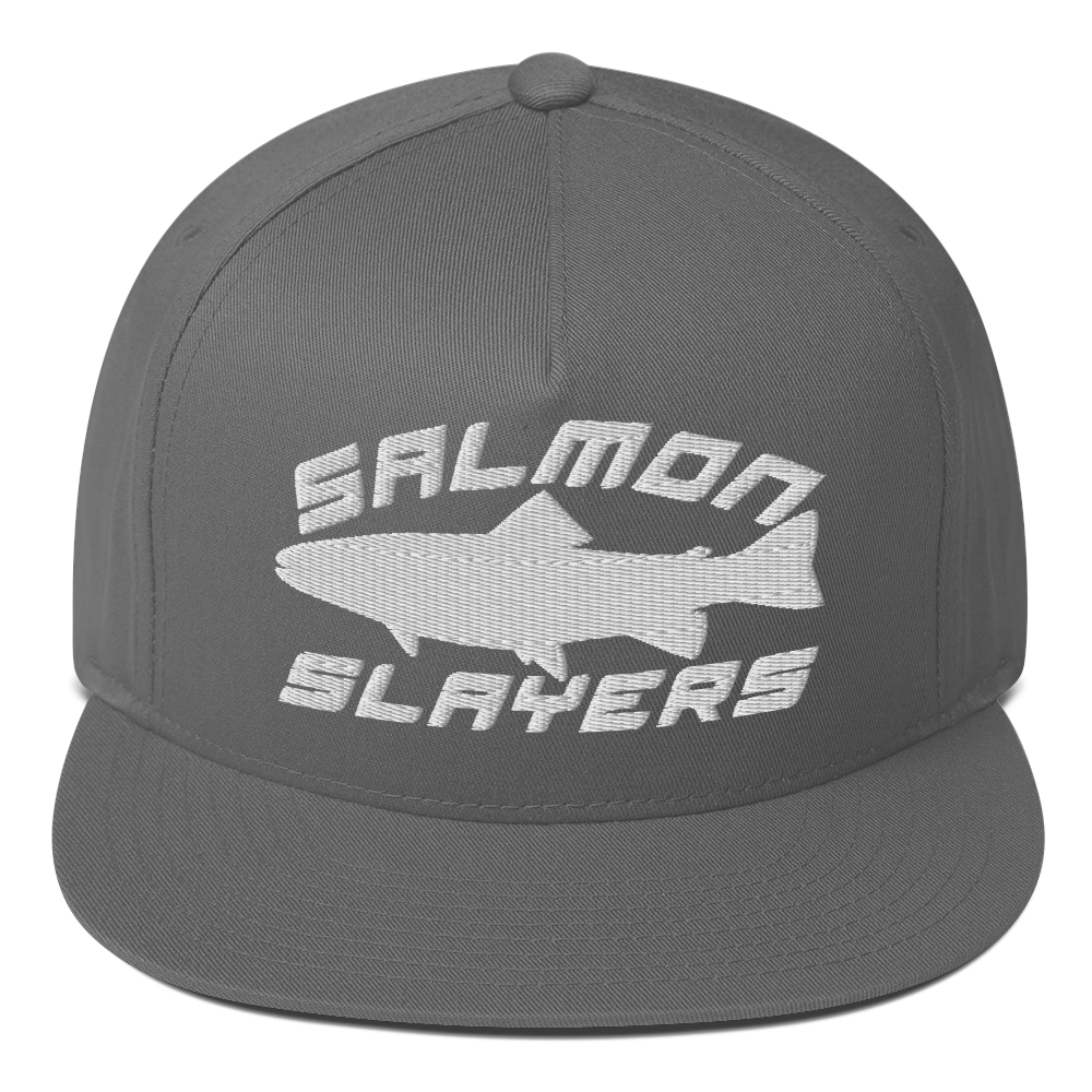 A black ***Salmon Slayers - Sport - Flat Bill Cap*** with a high-profile fit and snapback closure, featuring an embroidered design of a stylized salmon and "SALMON SLAYERS" in bold white letters above and below the fish. The green undervisor adds a unique touch to this stylish cap.