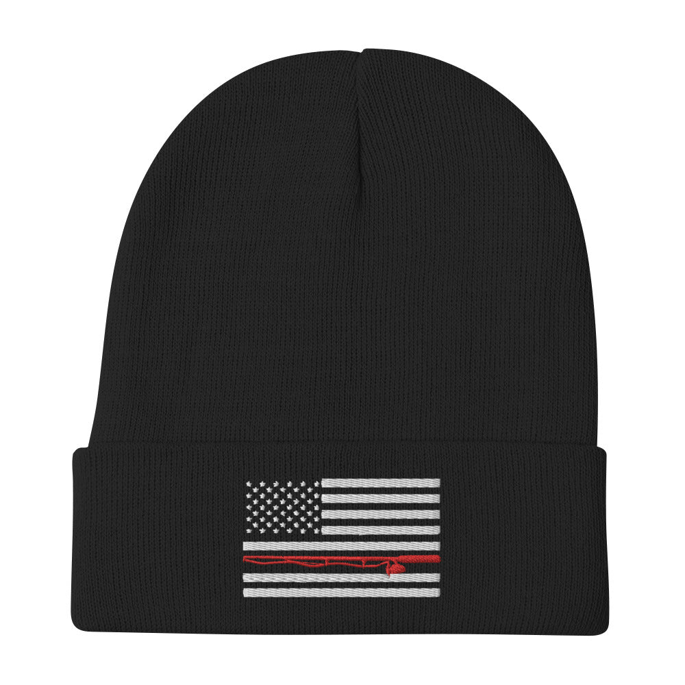 The Fishing Flag - Embroidered Beanie is a cozy black knit hat featuring an embroidered black and white American flag design. This flag includes a single thin red line running horizontally through the center, symbolizing support for firefighters. Perfect for showing your patriotism while staying warm on the water.