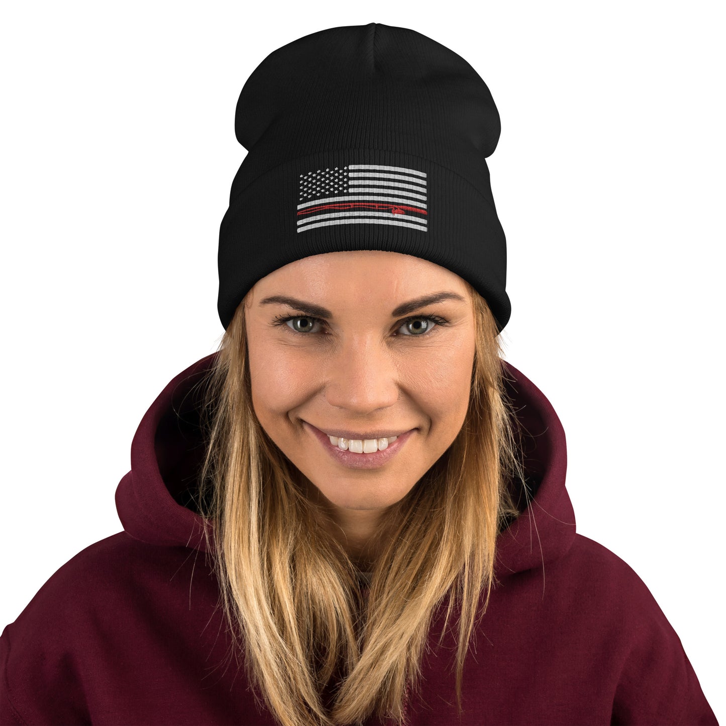 The Fishing Flag - Embroidered Beanie is a cozy black knit hat featuring an embroidered black and white American flag design. This flag includes a single thin red line running horizontally through the center, symbolizing support for firefighters. Perfect for showing your patriotism while staying warm on the water.