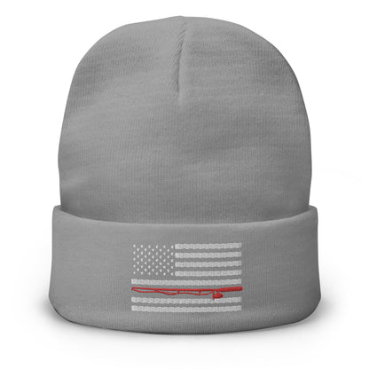 The Fishing Flag - Embroidered Beanie is a cozy black knit hat featuring an embroidered black and white American flag design. This flag includes a single thin red line running horizontally through the center, symbolizing support for firefighters. Perfect for showing your patriotism while staying warm on the water.