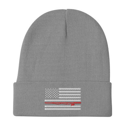 The Fishing Flag - Embroidered Beanie is a cozy black knit hat featuring an embroidered black and white American flag design. This flag includes a single thin red line running horizontally through the center, symbolizing support for firefighters. Perfect for showing your patriotism while staying warm on the water.