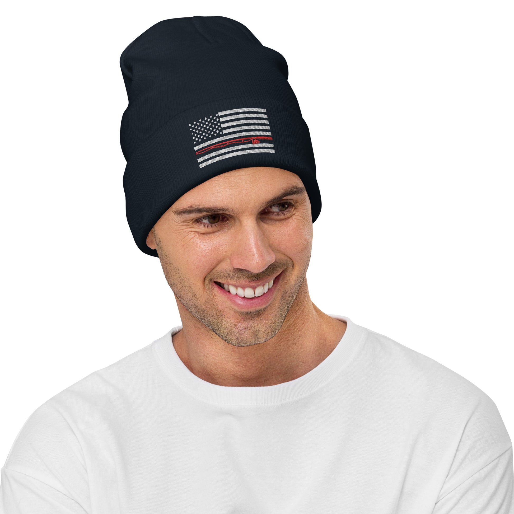 The Fishing Flag - Embroidered Beanie is a cozy black knit hat featuring an embroidered black and white American flag design. This flag includes a single thin red line running horizontally through the center, symbolizing support for firefighters. Perfect for showing your patriotism while staying warm on the water.