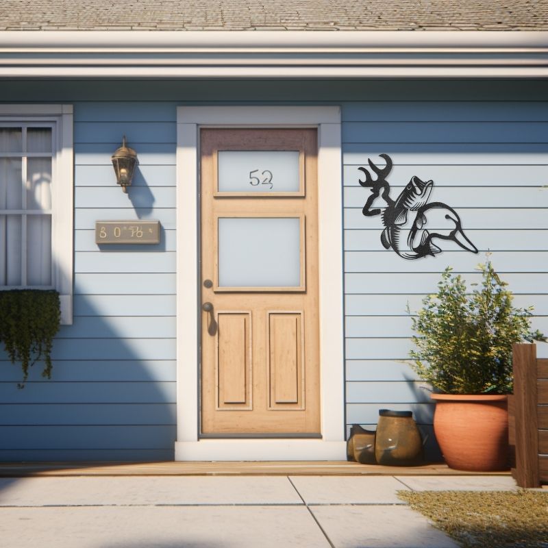 Wildlife Calling laser-cut steel sign featuring a deer, fish, and duck, mounted on a house exterior wall.