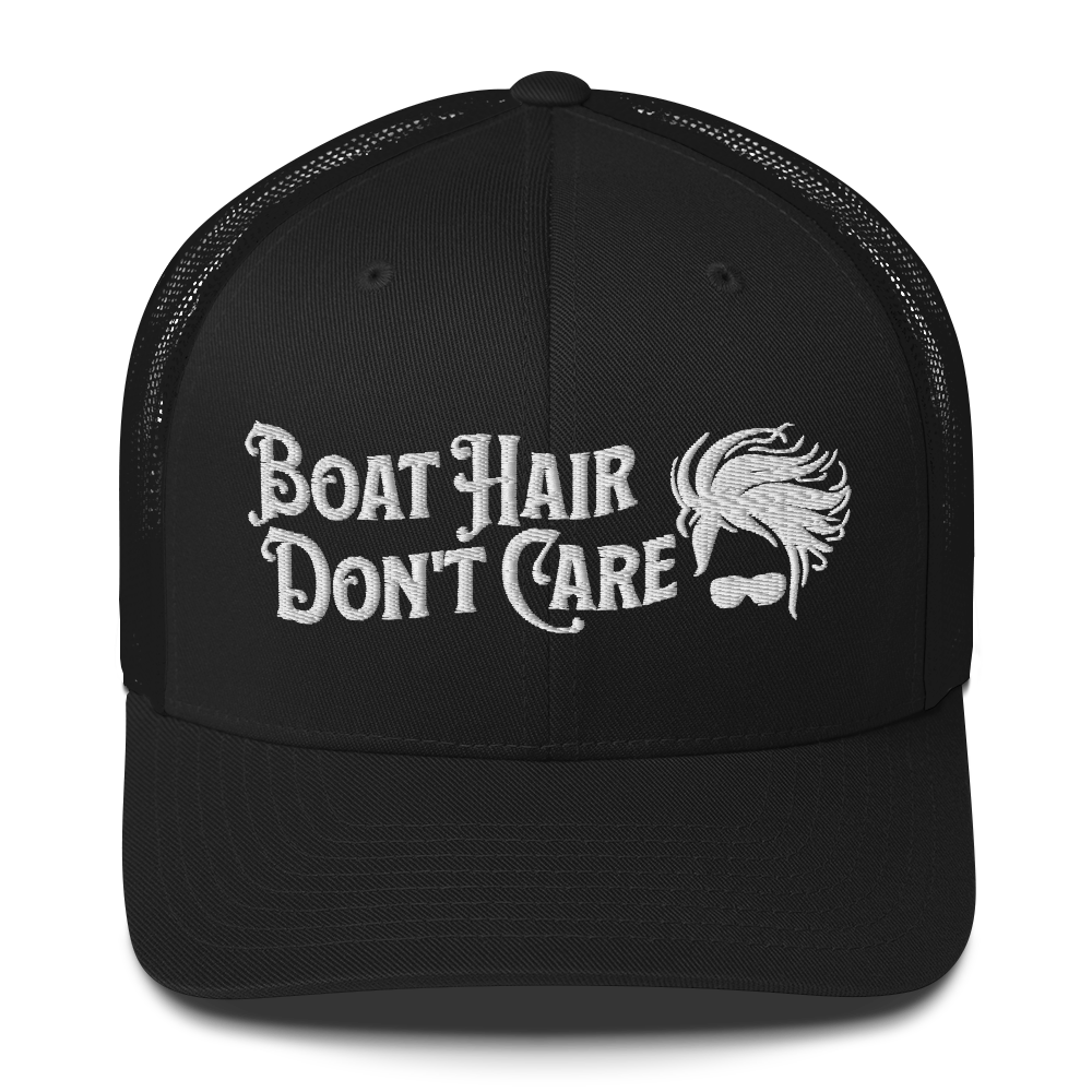 A Boat Hair, Don't Care - Trucker Style Fishing Cap with white mesh backing featuring the embroidered text "Boat Hair Don't Care" alongside a stylized illustration of hair blowing in the wind and a pair of sunglasses, making it the perfect fishing cap for your next adventure.