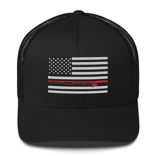 A black Fishing Flag Trucker Cap with an embroidered design of the American flag in white and gray. One of the horizontal stripes is red and features a silhouette of a bass fish. The flag design is centered on the front panel of this fishing enthusiasts hat.