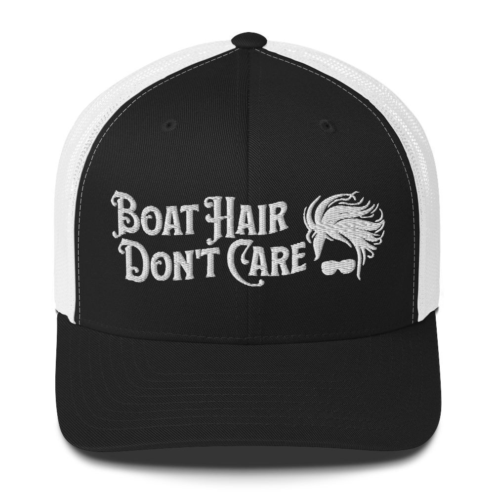 A Boat Hair, Don't Care - Trucker Style Fishing Cap with white mesh backing featuring the embroidered text "Boat Hair Don't Care" alongside a stylized illustration of hair blowing in the wind and a pair of sunglasses, making it the perfect fishing cap for your next adventure.