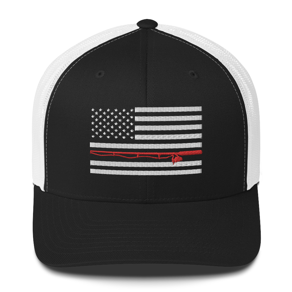 A black Fishing Flag Trucker Cap with an embroidered design of the American flag in white and gray. One of the horizontal stripes is red and features a silhouette of a bass fish. The flag design is centered on the front panel of this fishing enthusiasts hat.