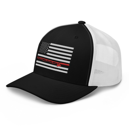 A black Fishing Flag Trucker Cap with an embroidered design of the American flag in white and gray. One of the horizontal stripes is red and features a silhouette of a bass fish. The flag design is centered on the front panel of this fishing enthusiasts hat.