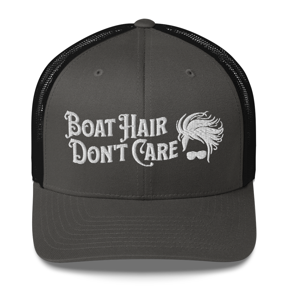 A Boat Hair, Don't Care - Trucker Style Fishing Cap with white mesh backing featuring the embroidered text "Boat Hair Don't Care" alongside a stylized illustration of hair blowing in the wind and a pair of sunglasses, making it the perfect fishing cap for your next adventure.