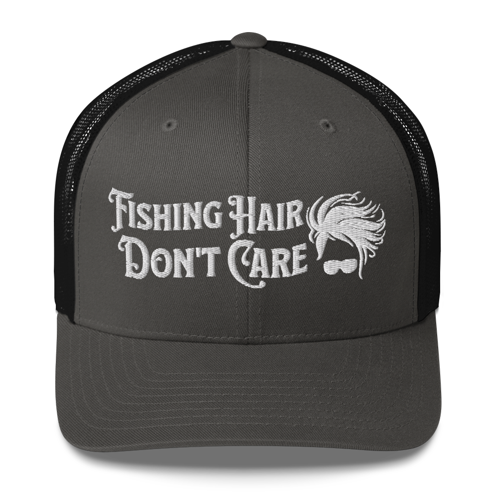 A black and white Fishing Hair, Don't Care - Trucker Style Fishing Cap with a curved brim and mesh back. The front of the cap features the embroidered text "Fishing Hair Don't Care" in white thread next to an image of stylized windblown hair and stylish sunglasses, perfect for fishing enthusiasts.