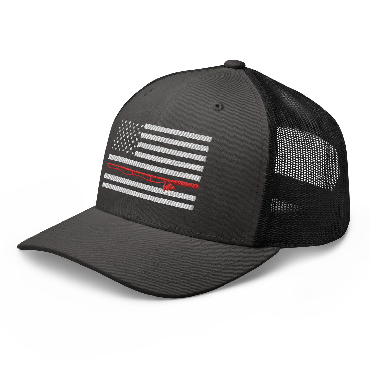 A black Fishing Flag Trucker Cap with an embroidered design of the American flag in white and gray. One of the horizontal stripes is red and features a silhouette of a bass fish. The flag design is centered on the front panel of this fishing enthusiasts hat.