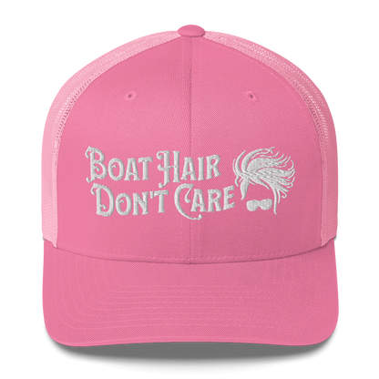 A Boat Hair, Don't Care - Trucker Style Fishing Cap with white mesh backing featuring the embroidered text "Boat Hair Don't Care" alongside a stylized illustration of hair blowing in the wind and a pair of sunglasses, making it the perfect fishing cap for your next adventure.