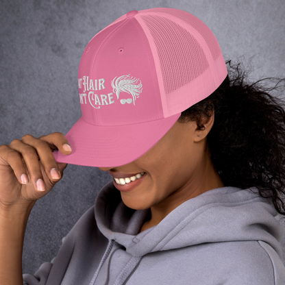 A Boat Hair, Don't Care - Trucker Style Fishing Cap with white mesh backing featuring the embroidered text "Boat Hair Don't Care" alongside a stylized illustration of hair blowing in the wind and a pair of sunglasses, making it the perfect fishing cap for your next adventure.