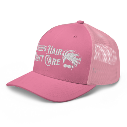 A black and white Fishing Hair, Don't Care - Trucker Style Fishing Cap with a curved brim and mesh back. The front of the cap features the embroidered text "Fishing Hair Don't Care" in white thread next to an image of stylized windblown hair and stylish sunglasses, perfect for fishing enthusiasts.