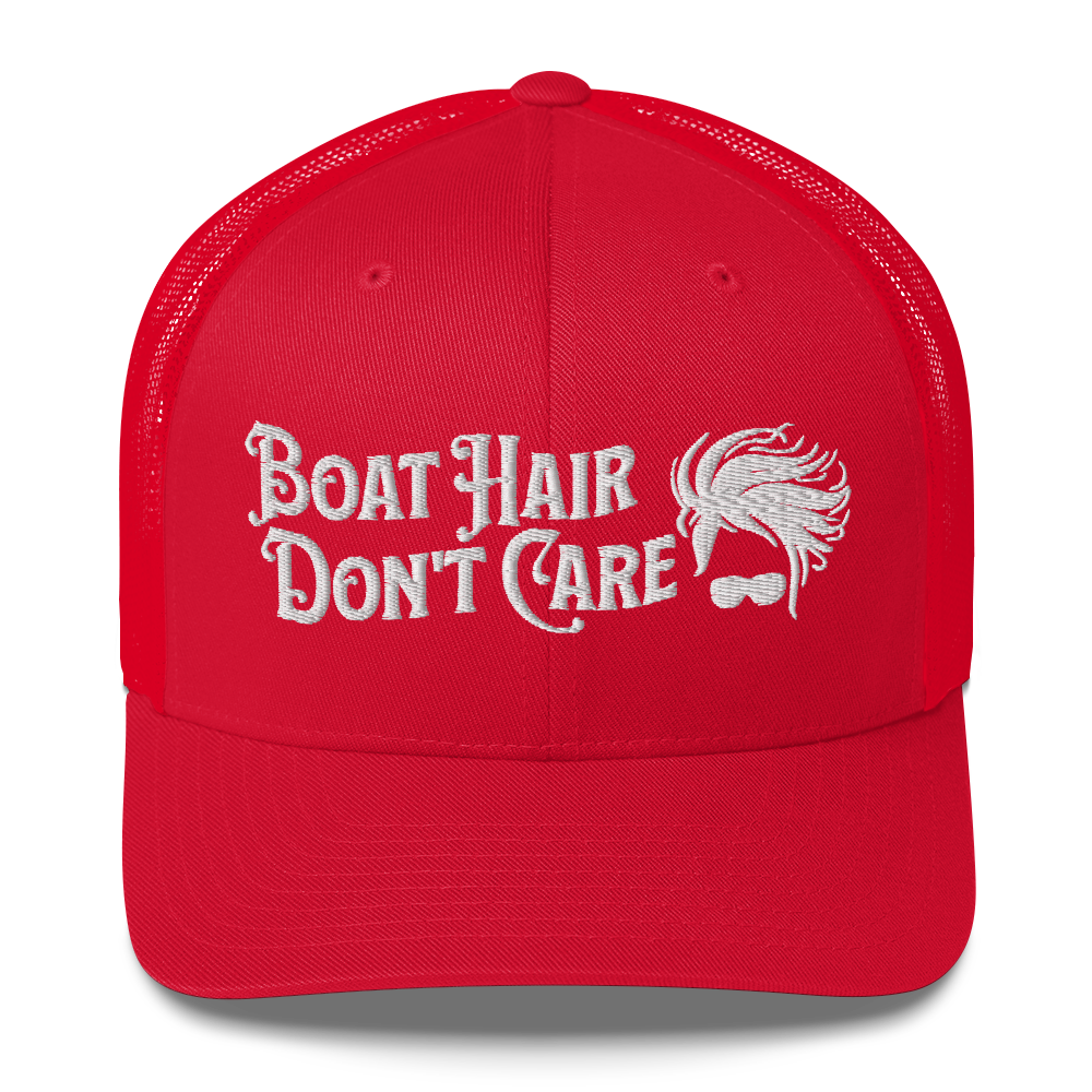 A Boat Hair, Don't Care - Trucker Style Fishing Cap with white mesh backing featuring the embroidered text "Boat Hair Don't Care" alongside a stylized illustration of hair blowing in the wind and a pair of sunglasses, making it the perfect fishing cap for your next adventure.